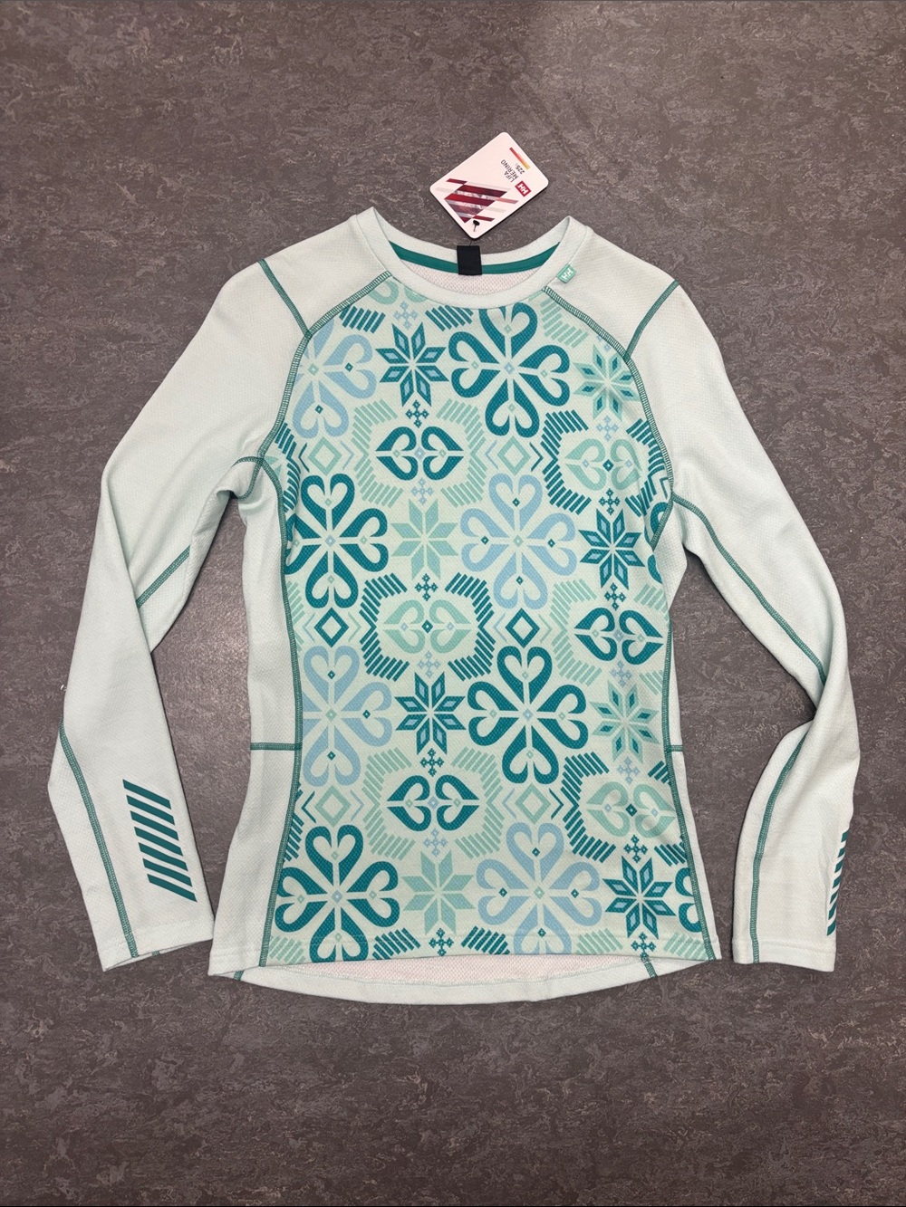Helly Hansen women’s Lifa merino midweight graphic crew icicle Nordic rose med